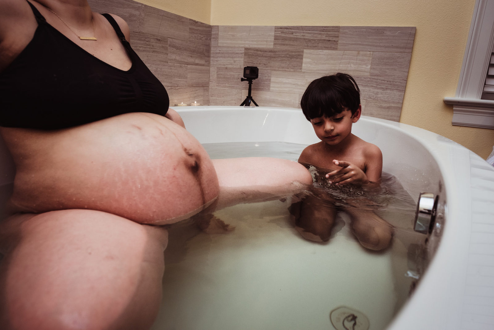 child in the birth tub