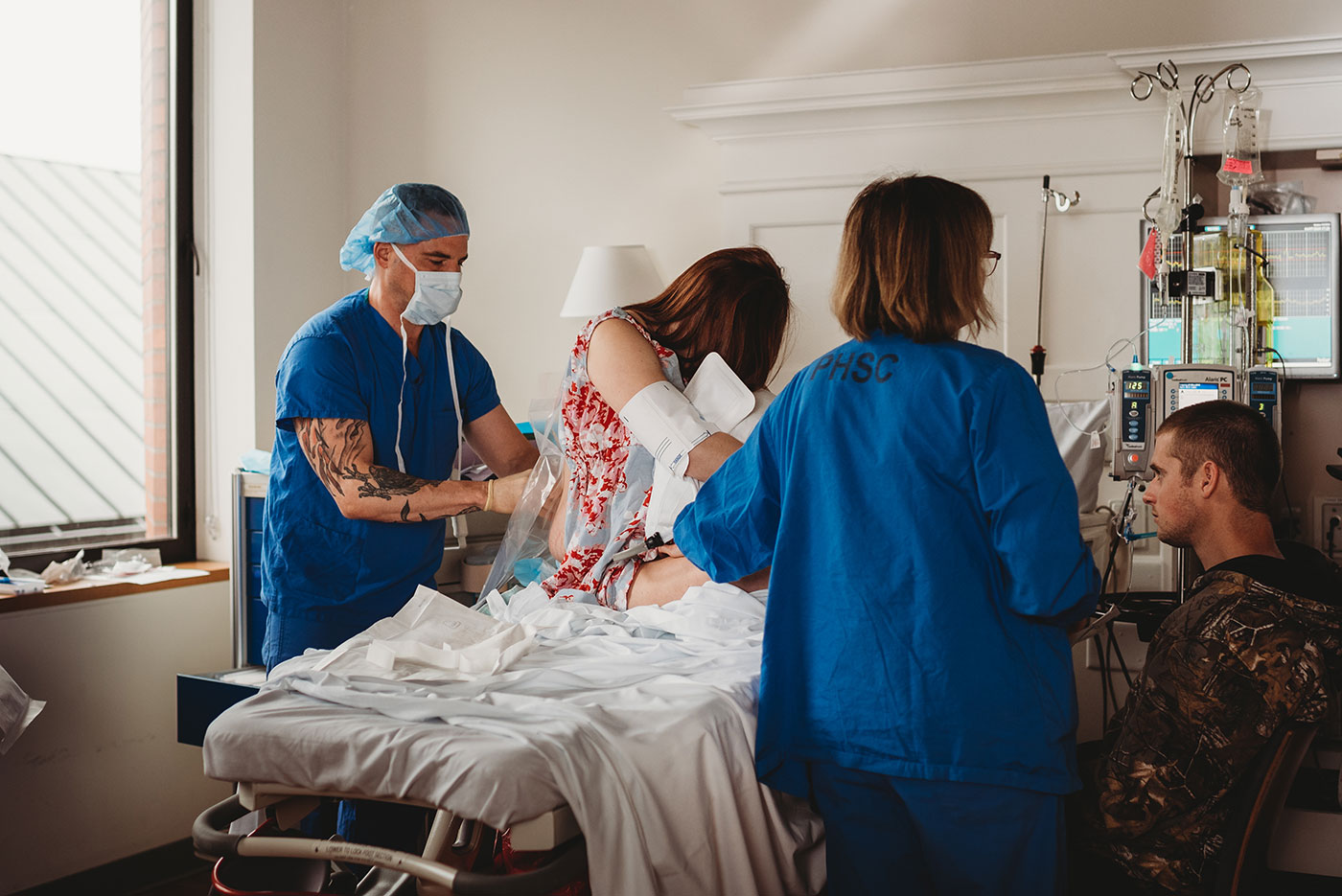 nurse and anesthesiologist prep laboring mom for an epidural at Good Samaratin hospital in Portland, Oregon