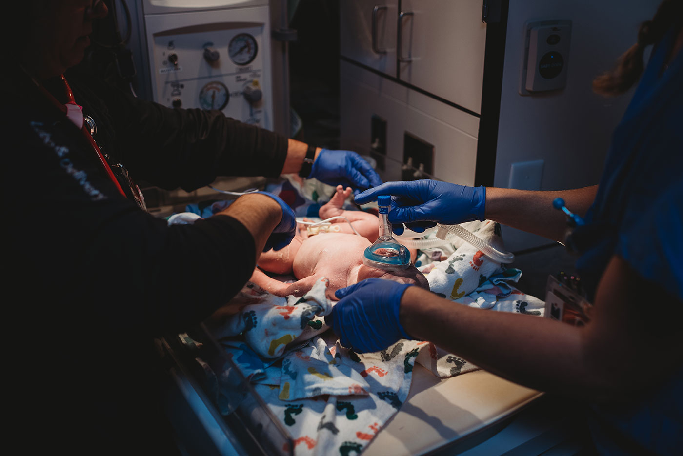 infant being resuscitated after born not breathing