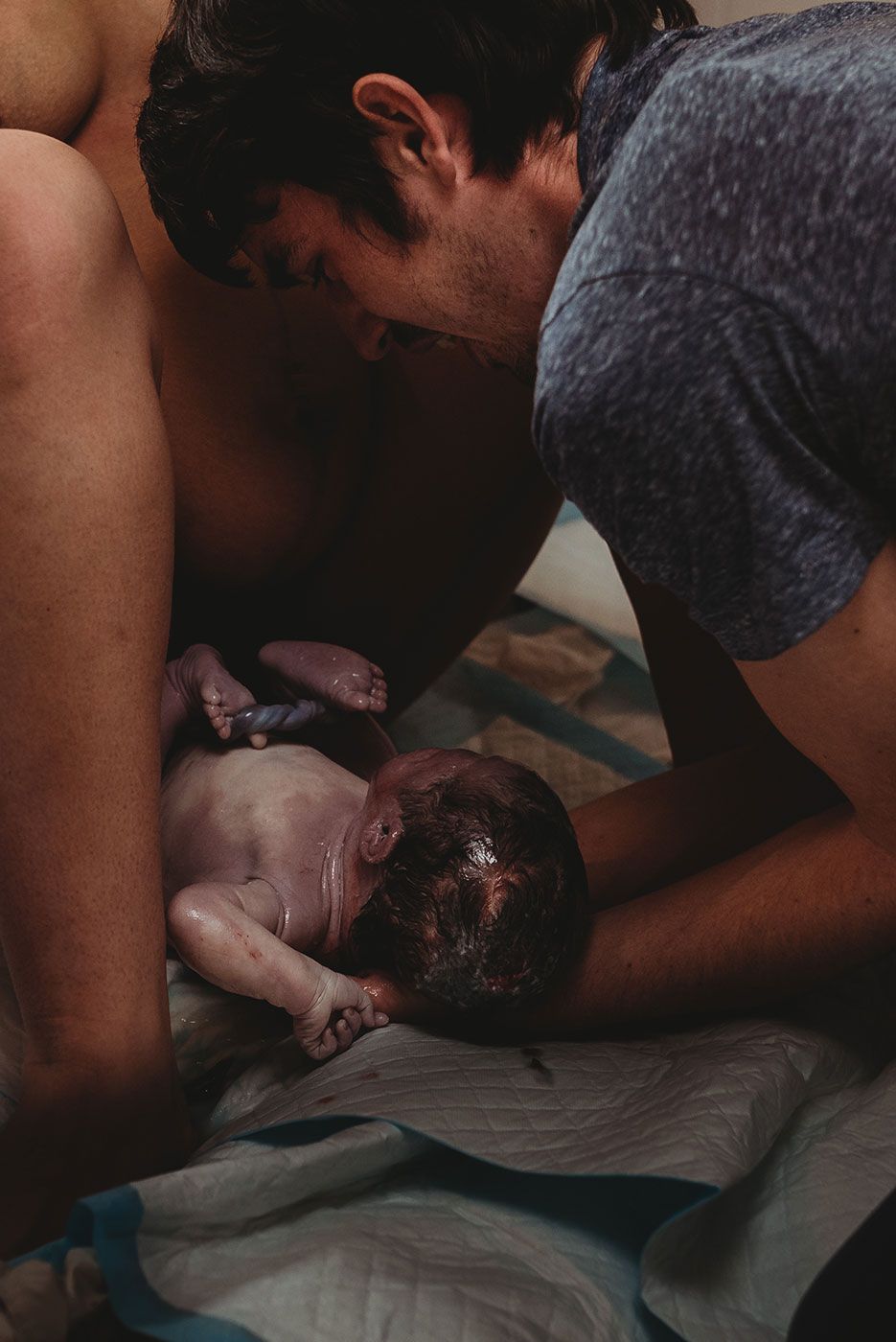 dad catches his baby being born at home