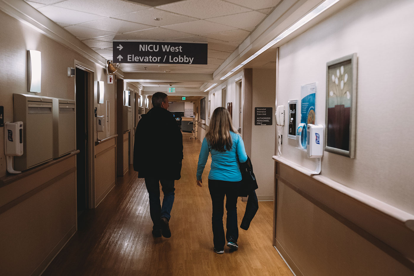 grandparents walk down the hallway toward Labor & Delivery at St Vincent hospital in Portland, Oregon