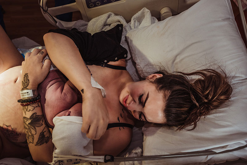 surrogate holding newborn baby